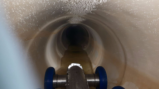 Robot looking down storm sewer